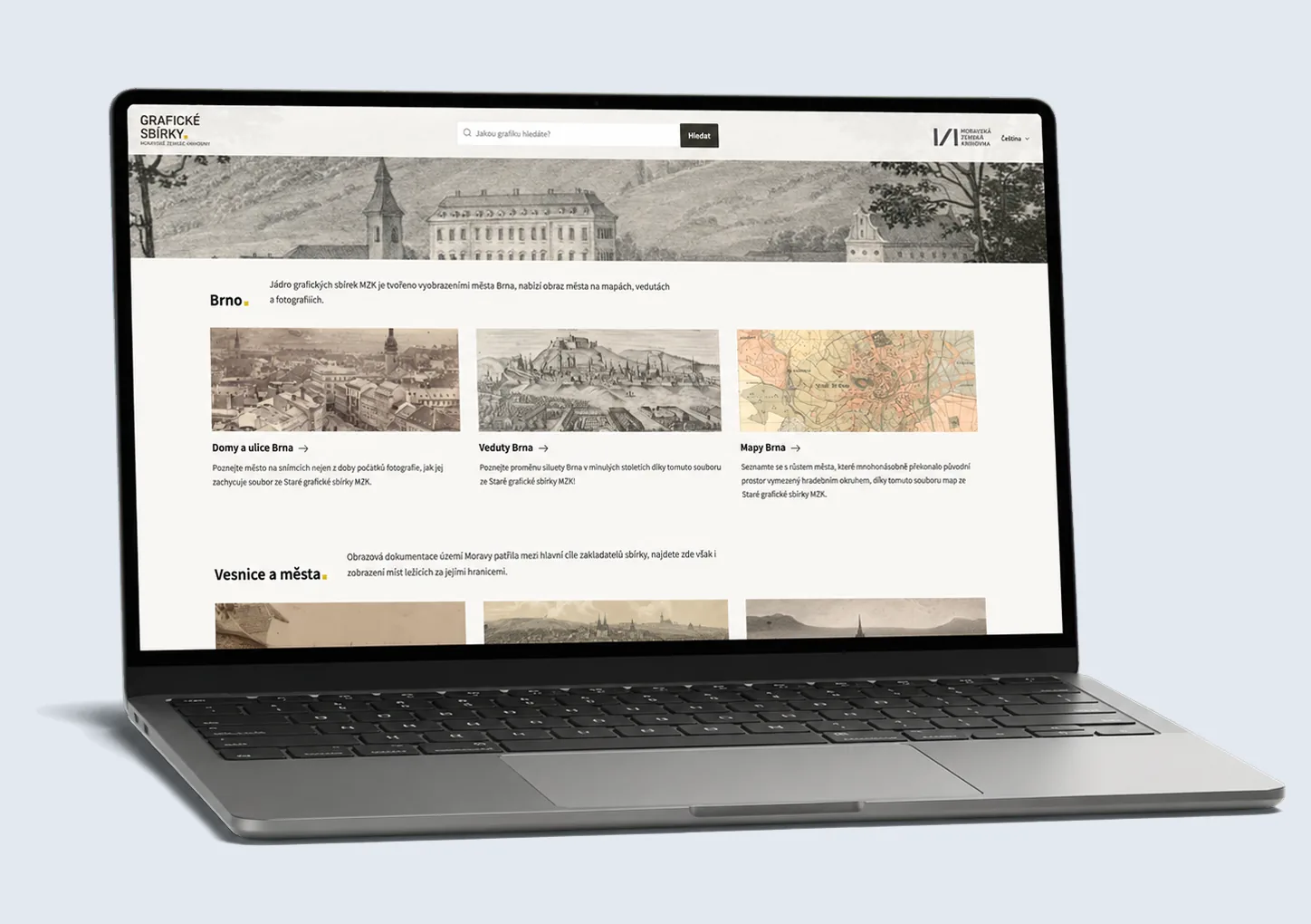 A laptop showing the home page of the Graphic Collections website